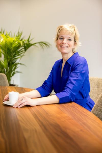 Astrid Dutré, Senior Estate Planner at Nagelmackers sitting at a table