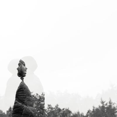 Double exposure image of a woman in a forest