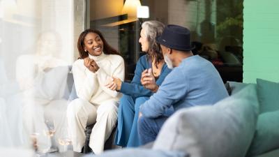  Happy family having a conversation on a couch