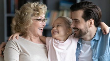 Smiling grandmother with son and granddoughter 