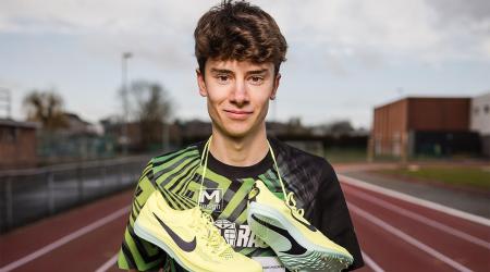 Tristan Gevaert with running shoos round his neck